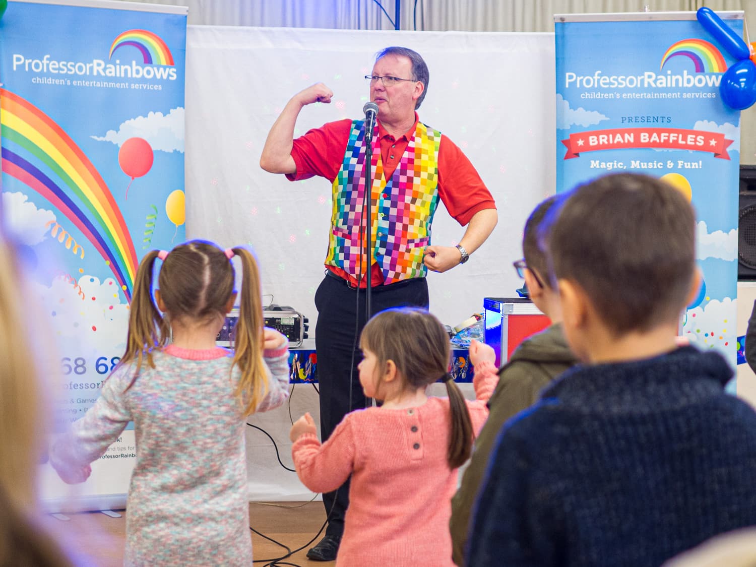 A entertainer teaching children dance moves