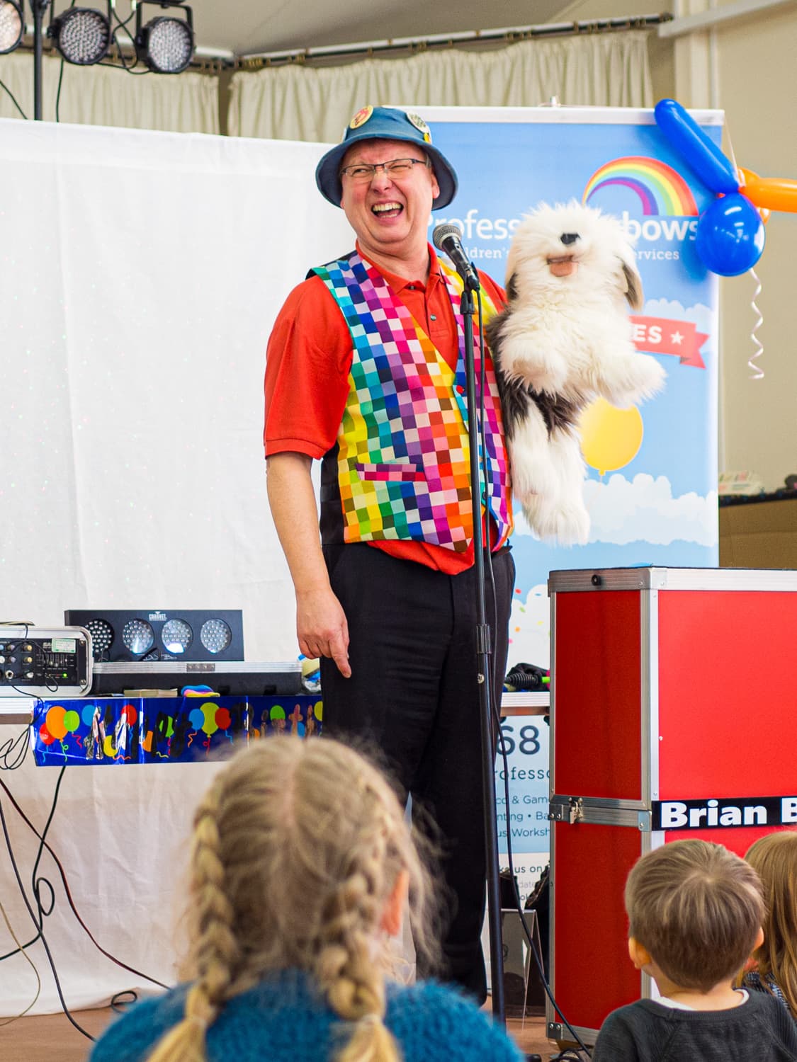 An entertainer with a cheeky dog puppet