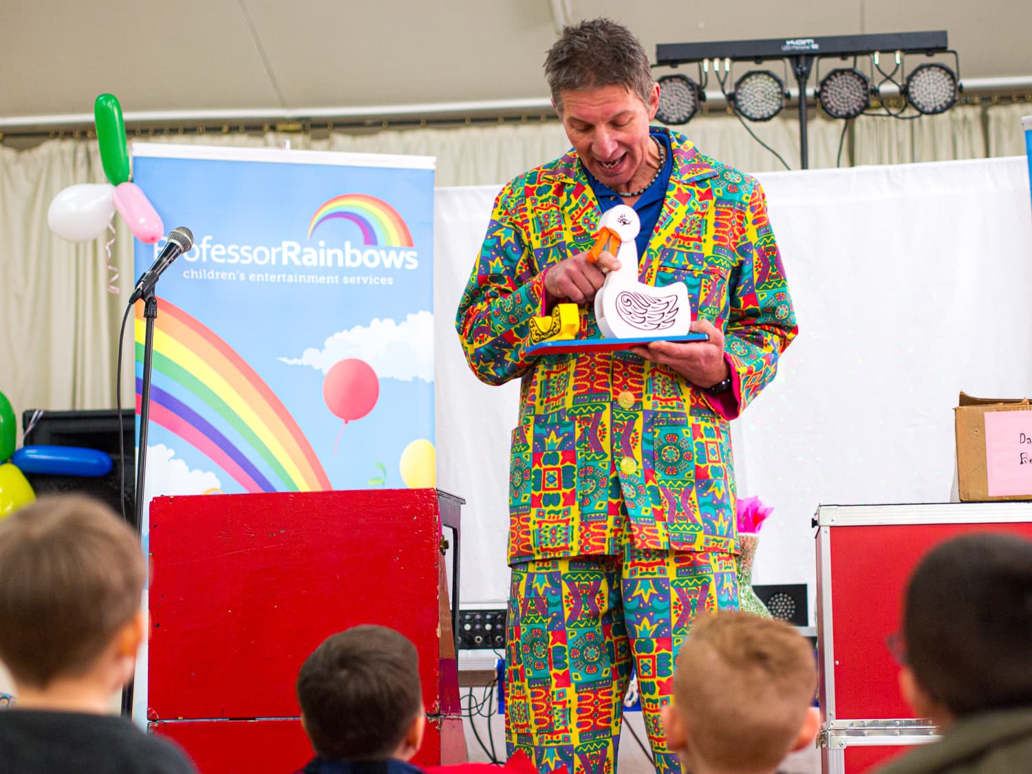 A children’s magician with a tick involving a naughty duck