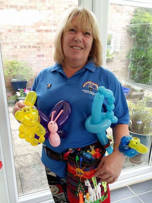 A balloon artist at a house party