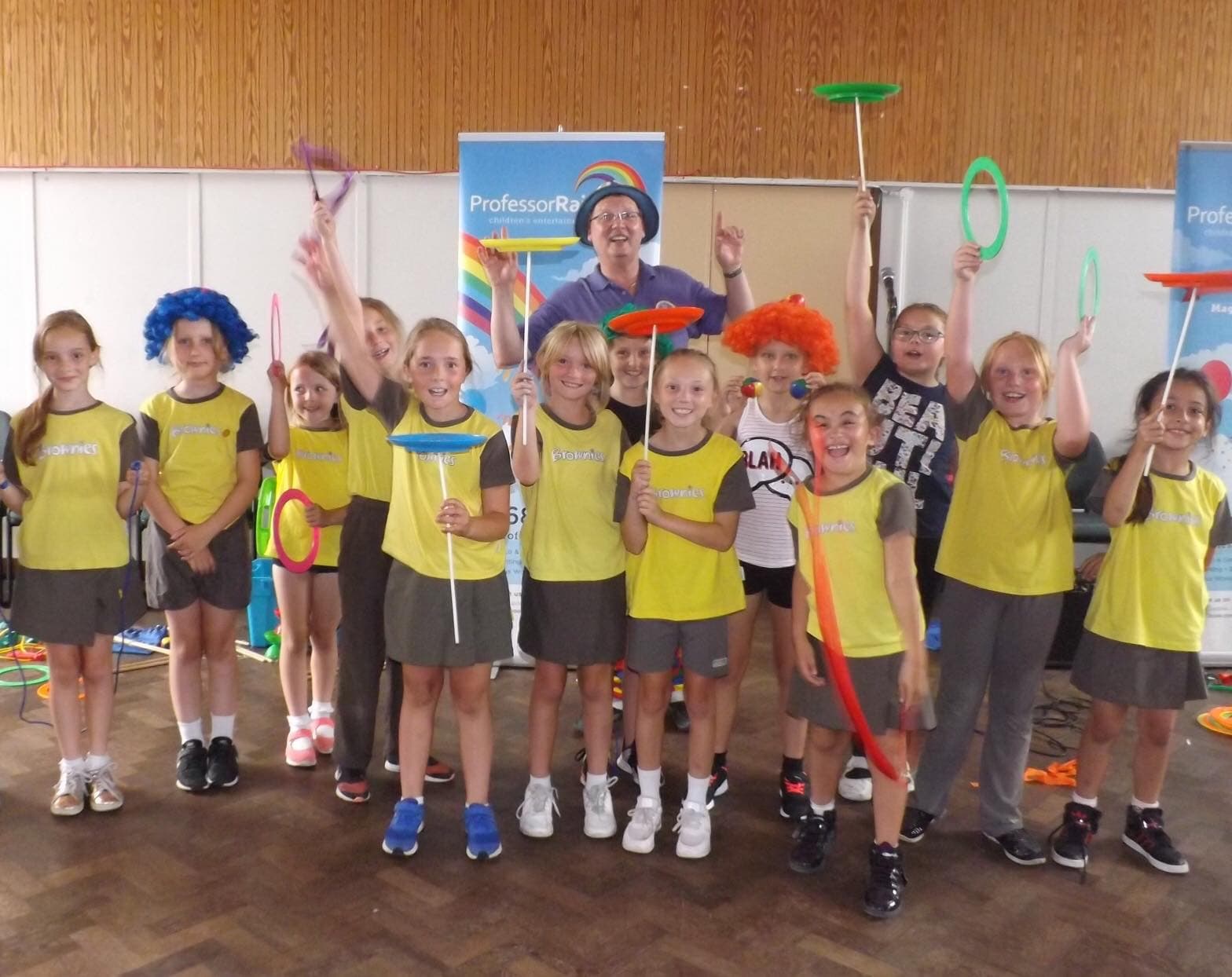 Group of children playing with circus equipment