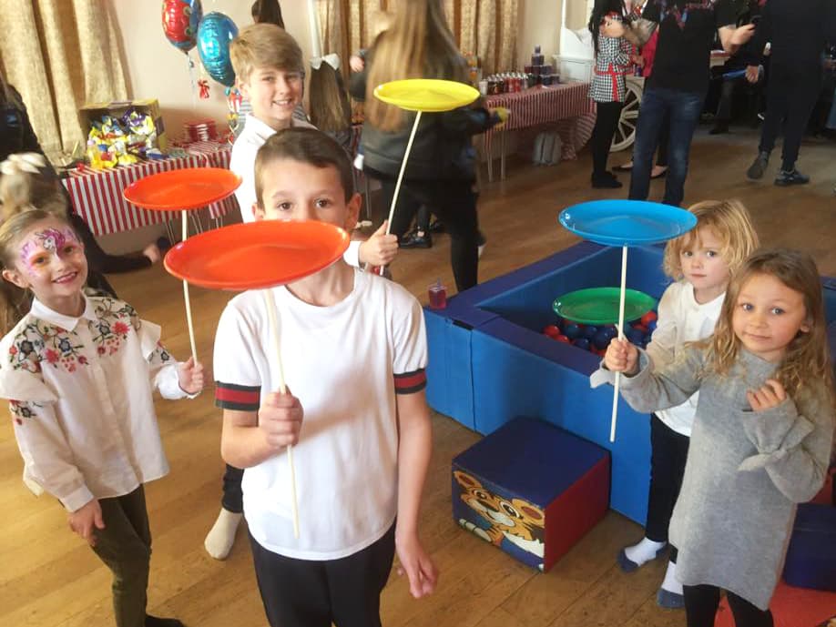 Children practising spinning plates